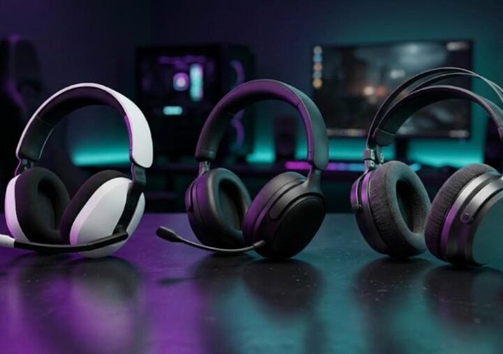 Three premium wireless gaming headsets side by side on a dark desk with purple and teal lighting